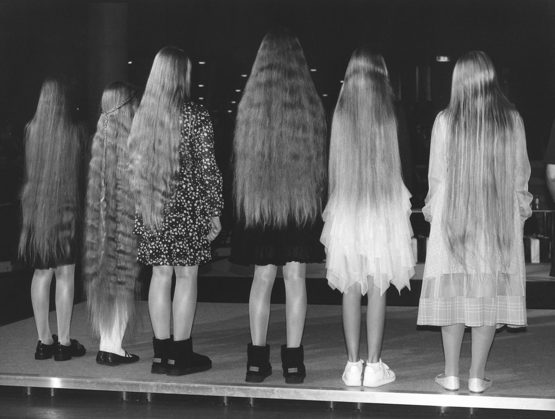 Francesca Allen measures the worth of hair at a folkloric beauty pageant