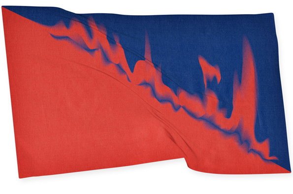 A fabric textile featuring a bold, abstract design in red and deep blue. A jagged, flame-like red shape cuts diagonally across the blue background.