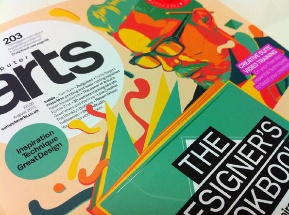 A copy of Computer Arts magazine featuring a colourful, stylised portrait of a person wearing glasses. Overlapping the magazine is a green book titled “The Designer’s Lookbook”.