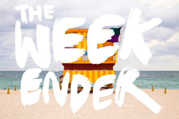 A yellow and red striped lifeguard tower stands on a sandy beach against a cloudy sky. Large, white hand-drawn text laid over the image reads “THE WEEKENDER”.
