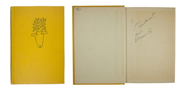 A yellow notebook is shown both closed and open. The cover features a simple line drawing of a reindeer head. Inside, a handwritten note reads “To Joan Christmas 89 from Mom & Pa”.