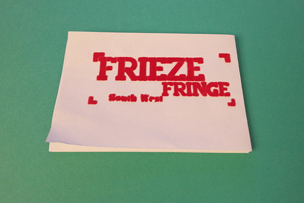 A white card on a green background features red, blocky typography that reads “Frieze Fringe”. Smaller text below reads “South West”.