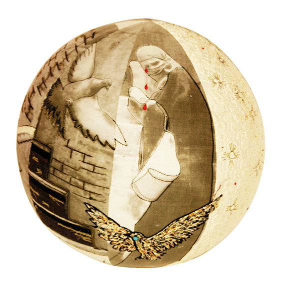 A painting on a spherical object depicts a figure in a dark cloak with a white cloth covering their head. Two birds fly around the figure, one white and one golden, against a backdrop of a grey brick wall.