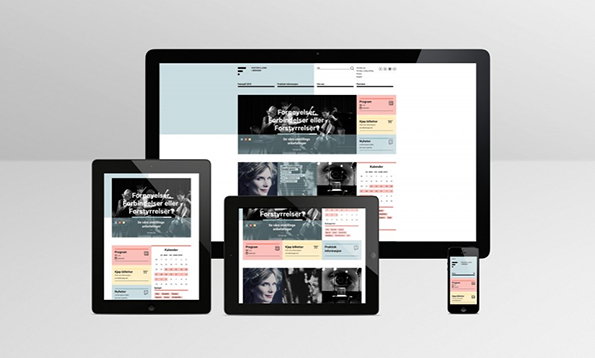 A 3D render of a website displayed across a desktop monitor, two tablets and a smartphone. The interface features a clean white layout with a dark hero image and colourful grid blocks.