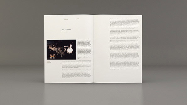 An open book displays a layout with a large block of text and a black and white photograph. The page on the left features the headline “Just Add Water” above an image of a technical installation.