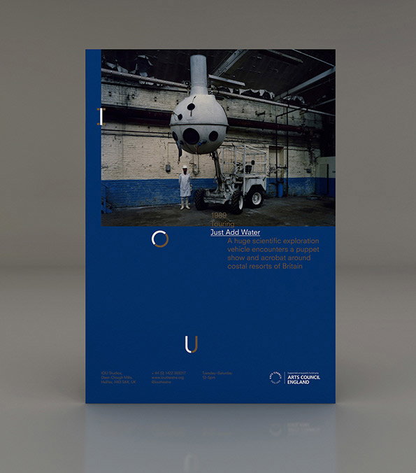 A blue brochure cover featuring a photograph of a person standing beside a large, spherical scientific vehicle in a warehouse. Below the image, text reads “1989 Touring Just Add Water” followed by a short summary of the performance.