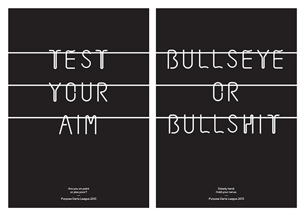 Two black posters with white linear typography. The first reads “TEST YOUR AIM” and the second reads “BULLSEYE OR BULLSHIT”. Small text at the bottom of both identifies the “Purpose Darts League 2013”.