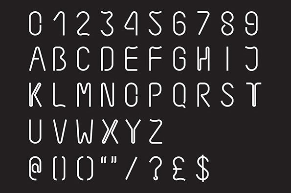 A white sans-serif typeface displayed against a black background. The set includes numbers, uppercase letters and common symbols, all rendered with a rounded, tubular appearance.