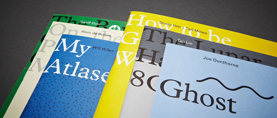 A row of overlapping book covers in various colours. Legible titles include “My Atlas” by Will Wiles and “Ghost” by Joe Dunthorne.