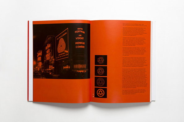 An open book with bright orange pages. The left page shows a high-contrast image of a city street at night with a large billboard for the film “Midnight Cowboy”.