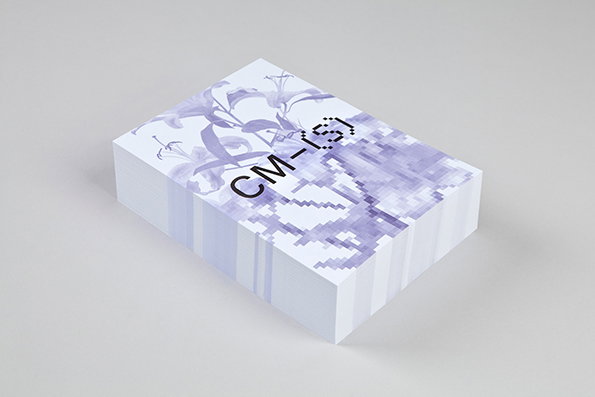 A rectangular white box features a purple illustration of lilies. The image transitions from a detailed drawing into a pixelated pattern, with the text “CM- {§}” printed across the centre.