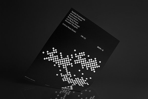 A black printed page features a cluster of small white squares arranged in a fragmented, organic shape. Text at the top reads “Spatial Experiments and Audio/Visual Explorations – Blurring Dream and Reality through Elevated Thoughts” and “Critical Mass Studio”.