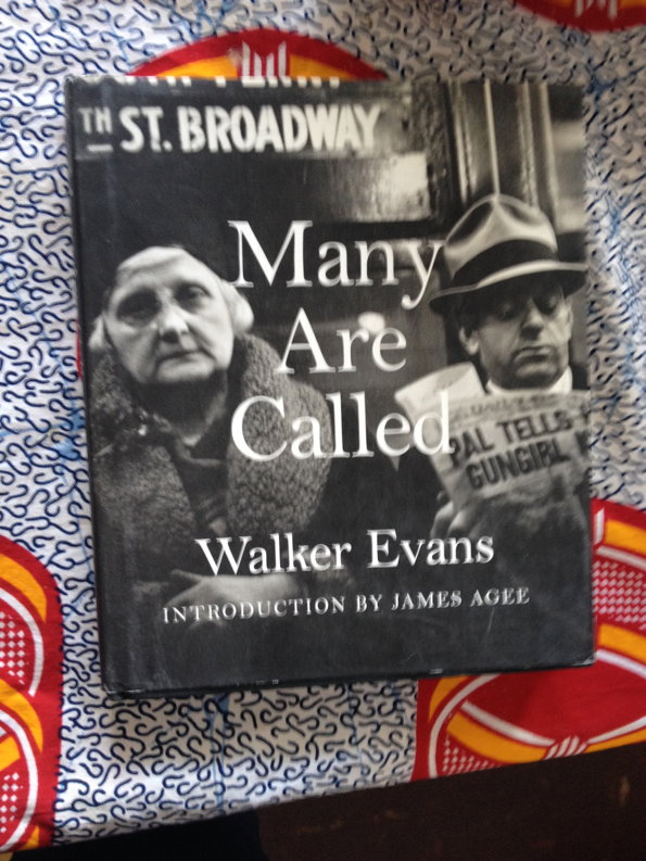 The cover of a book by Walker Evans titled “Many Are Called”. A black and white photograph shows two people, one wearing a textured coat and the other a hat and holding a newspaper.