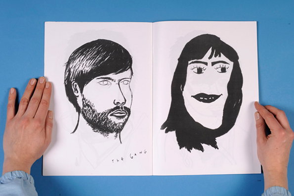 An open sketchbook shows two black and white ink portraits of people. Below the figure on the left, the words “THE GANG” are handwritten in capital letters.