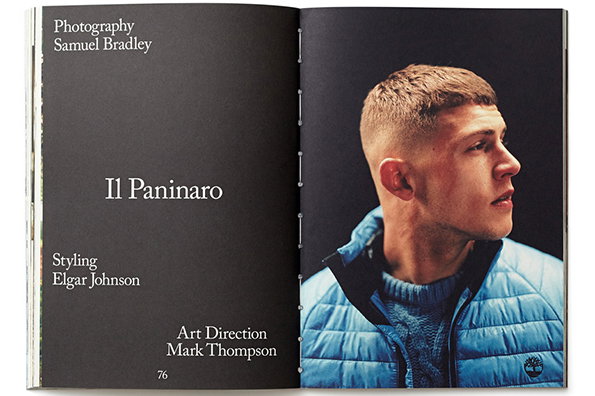 An open magazine spread features a profile portrait of a person wearing a blue quilted jacket and a cable-knit sweater. The opposite page is dark grey with the title “Il Paninaro” and credits for photography, styling and art direction.