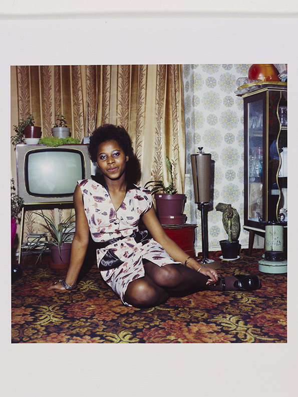 Neil_Kenlock_Untitled_Young_woman_seated_on_the_floor_at_home_in_front_of_her_television_set_C-_type_print_London_1972__Neil_Kenlock_Victoria_and_Albert_London-int.jpg