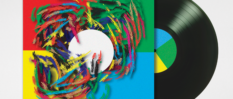 A vinyl record sits partially tucked into its sleeve. The cover features a white circle surrounded by chaotic, colourful scribbles over a background of red, green, blue and yellow quadrants.