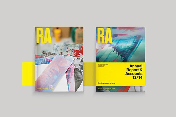 Two copies of a publication for the Royal Academy of Arts. The covers feature bold yellow “RA” lettering and abstract imagery, with one reading “Annual Report & Accounts 13/14”.