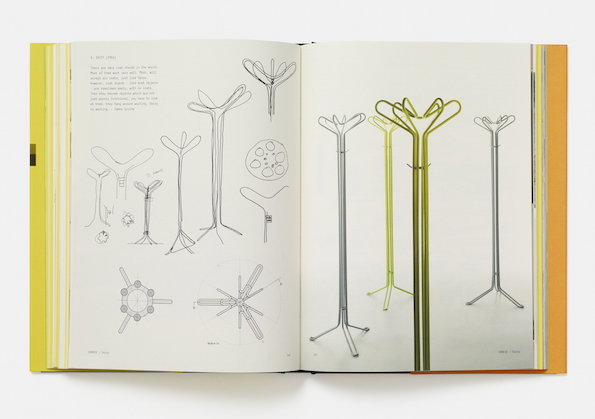An open book shows a series of technical drawings and photographs of slender, tubular coat stands. The stands feature minimalist, branching tops and tripod bases in silver and lime green.