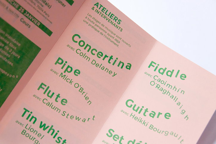 A close-up of a pink brochure listing music workshops. Green text lists instruments and tutors, including “Concertina avec Colm Delaney” and “Fiddle avec Caoimhín O’Raghalláigh”.