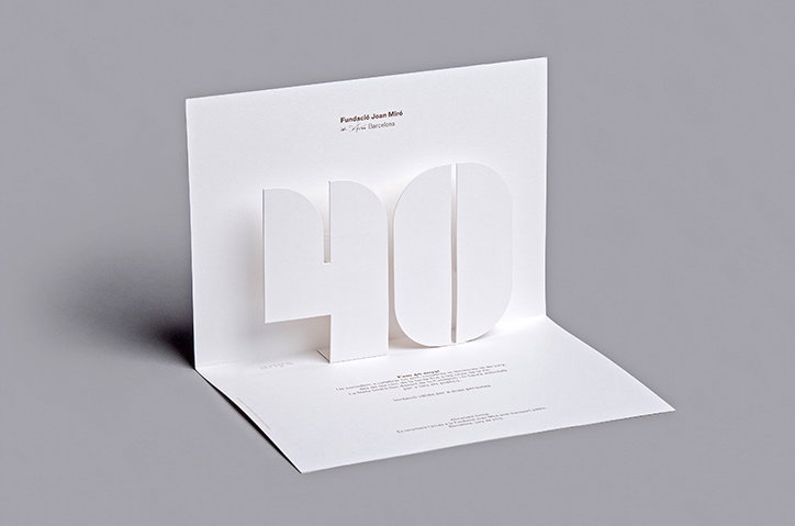 A white pop-up card opens to reveal a large, three-dimensional number “40”. Text at the top reads “Fundació Joan Miró” and “Barcelona”.