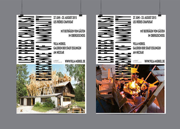 Two posters hang side by side against a grey wall. Both feature the vertical text “Les Frères Chapuisat” and “Obsolescence of Immortality”, alongside the dates “27. Juni – 23. August 2015”. The left poster shows a house with a chaotic, sprawling wooden structure built over its roof. The right poster shows a night scene of people gathered around a glowing fire inside a similar wooden structure.