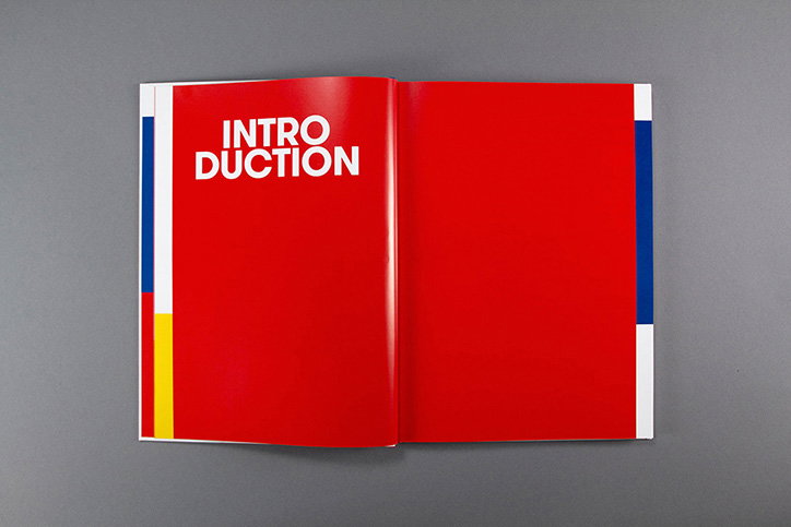 An open book with two bright red pages. The left page features the word “INTRODUCTION” split across two lines in bold white capitals.