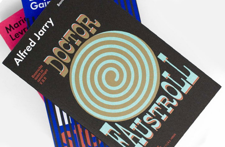 A book cover for Alfred Jarry’s “Doctor Faustroll” features a large, swirling spiral in blue and gold. The title is written in bold, stylised lettering that curves around the central graphic.