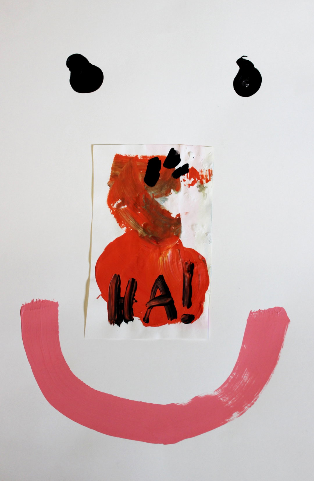 A painting of a smiley face on a white background. Two black dots for eyes sit above a pink painted curve, with a central collage piece featuring red paint and the word “HA!”.