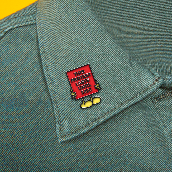 Sagmeister-Walsh-Pins-Won't-Save-the-World_Protesting-til-2020-Pin.png
