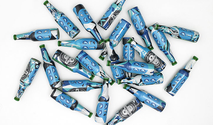 Emily Forgot designs one-of-a-kind graphics for 2000 Heineken Bottles