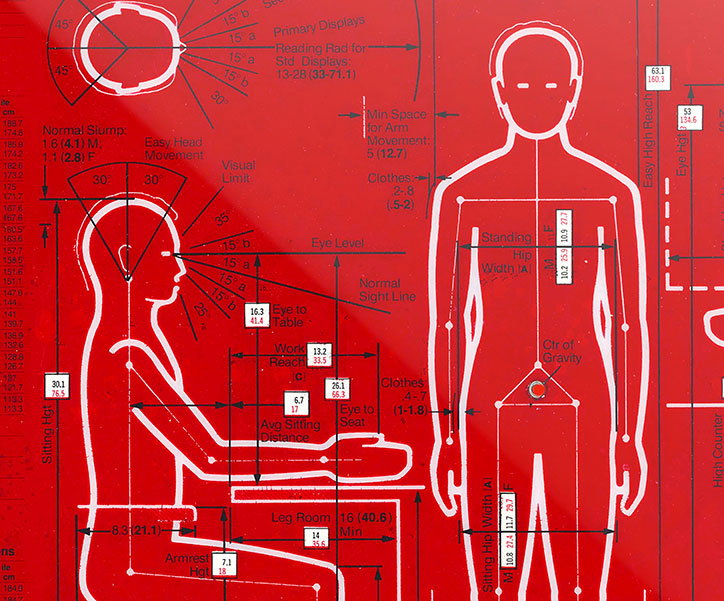A technical diagram in white on a red background shows the ergonomic measurements of a person. One figure is shown in profile sitting at a desk, while another is shown from the front.