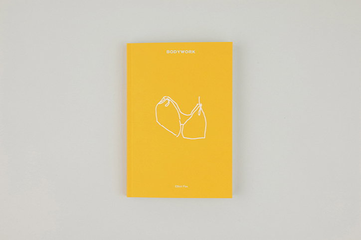 A yellow book cover features a simple white line drawing of a bra. The word “BODYWORK” is printed at the top, with the name “Elliot Fox” at the bottom.
