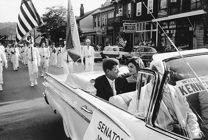 Mark-Shaw_Kennedys_Proud-Galleries_photography_itsnicethat_Jackie-and-JFK-in-Campaign-Car_-Wheeling_-1959.jpg