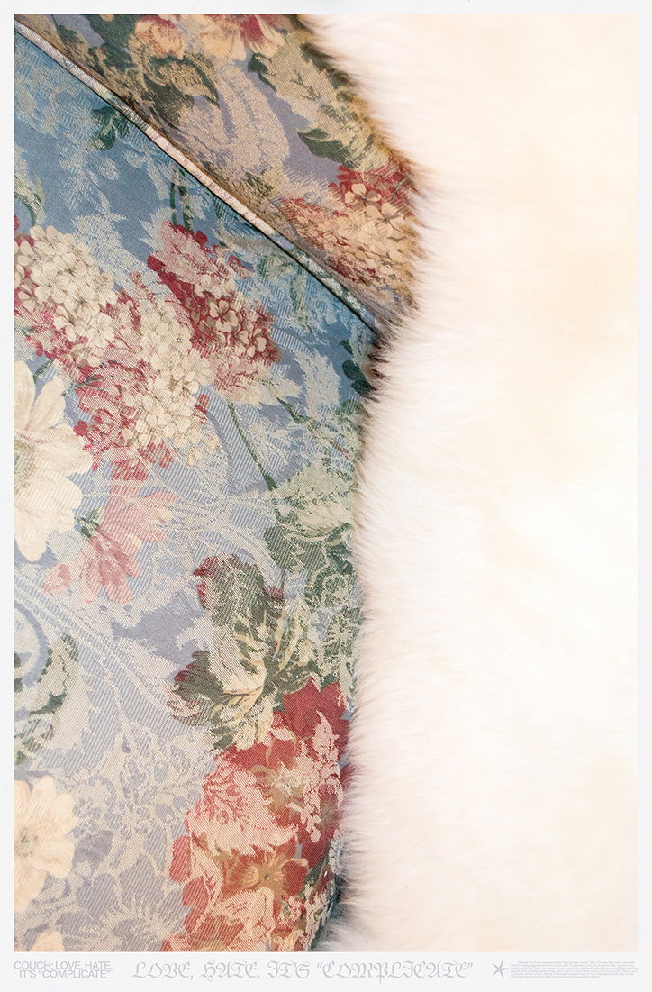 A close-up of a blue floral fabric draped next to a white faux-fur rug. Text at the bottom reads “Love, Hate, It’s “Complicate””.