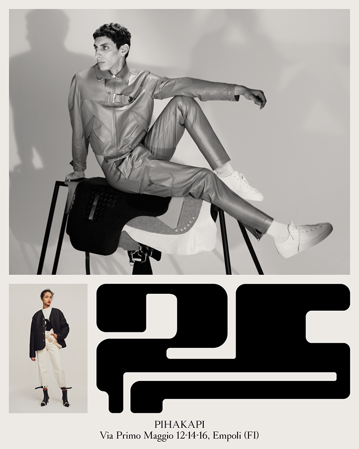 A black and white fashion lookbook page. A person poses in a metallic suit and white trainers, sitting on a sculptural black seat. Below, a smaller image shows a person in a black cardigan and white trousers, alongside a bold, abstract black graphic and the text “PIHAKAPI Via Primo Maggio 12-14-16, Empoli (FI)”.