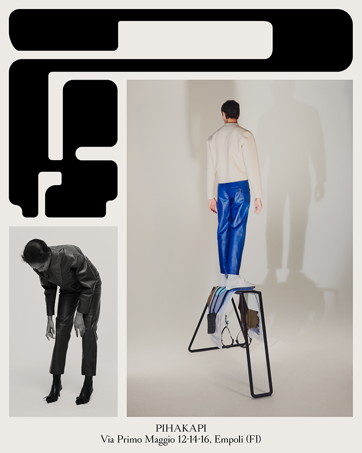A fashion lookbook page featuring two photographs of people in contemporary clothing. One person stands on a black metal frame wearing a white jacket and bright blue trousers, while another leans forward in a black leather outfit. Text at the bottom reads “PIHAKAPI” and “Via Primo Maggio 12-14-16, Empoli (FI)”.