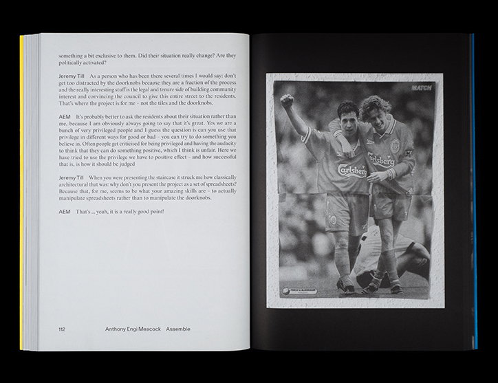 An open book shows a page of interview text opposite a black and white photograph. The image depicts two football players embracing on a pitch, with the word “Carlsberg” visible on their jerseys.