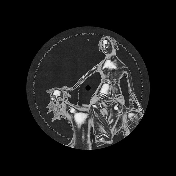 A black vinyl record featuring a silver illustration of a figure riding a creature. The figure sits upright, holding a lead attached to the creature’s head.