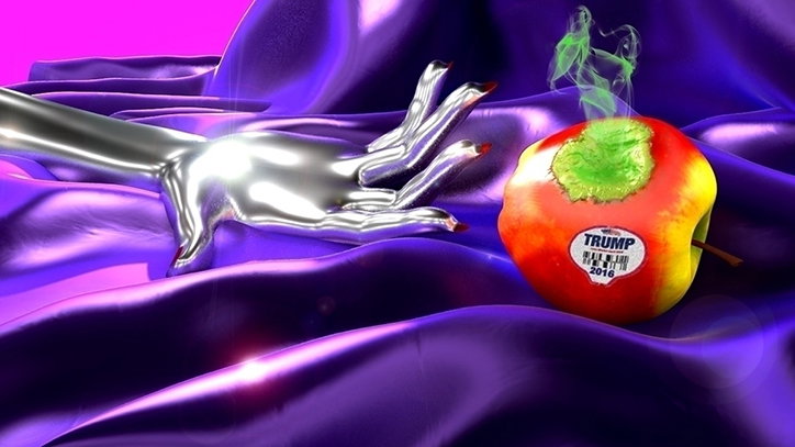 A 3D render of a metallic silver hand reaching towards a bitten apple on a draped purple fabric. The apple has a sticker that reads “TRUMP 2016” and green smoke rises from its core.