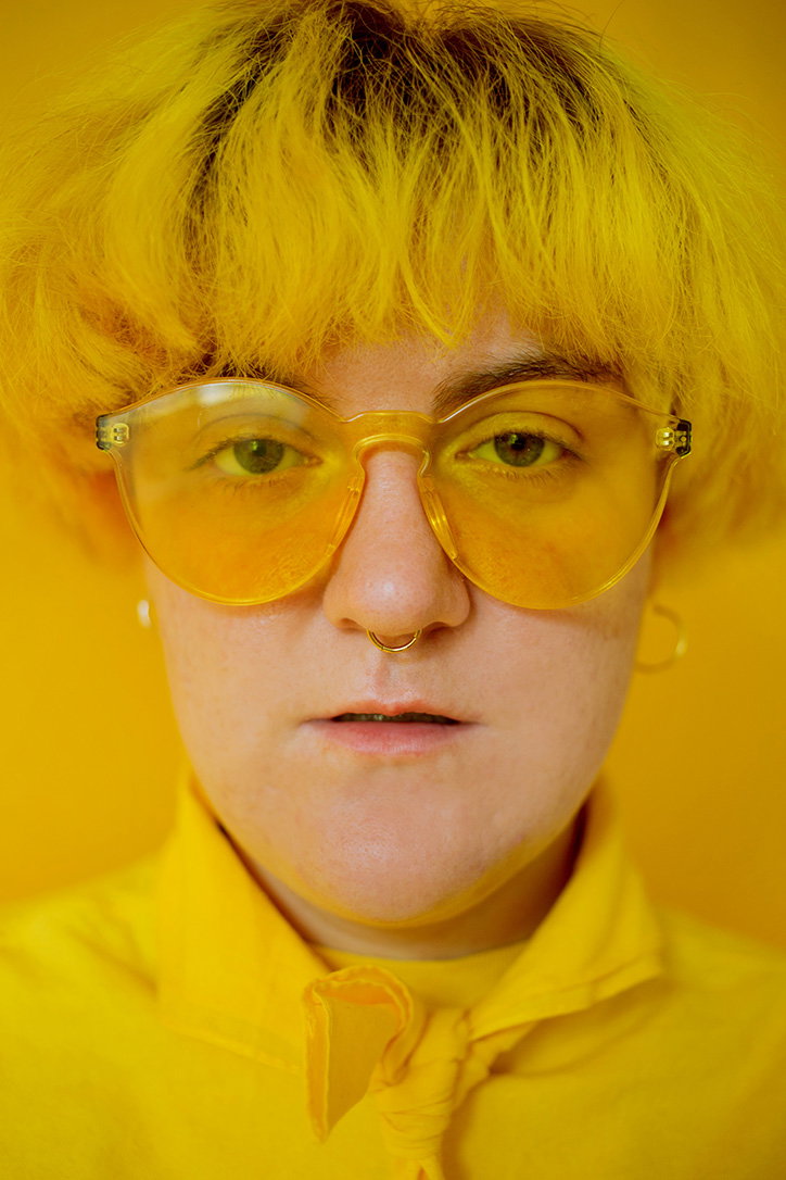 LaurencePhilomene-PortraitofJoannainYellowMontreal-NonBinaryPortraits-Photography-itsnicethat-0.jpg
