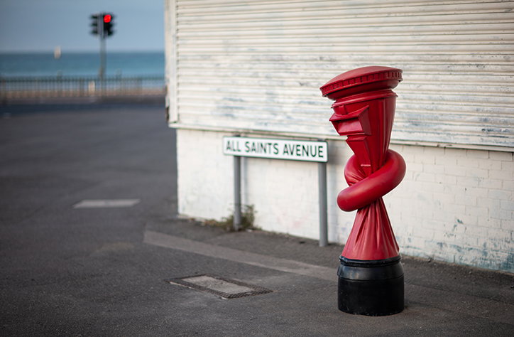 Artist Alex Chinneck knots post boxes in London, Margate and Sheffield