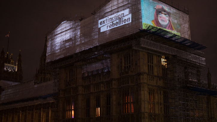 Jamie-Hewlett_Extinction_Rebellion_projection_houses-of-parliament_art_itsnicethat.jpg