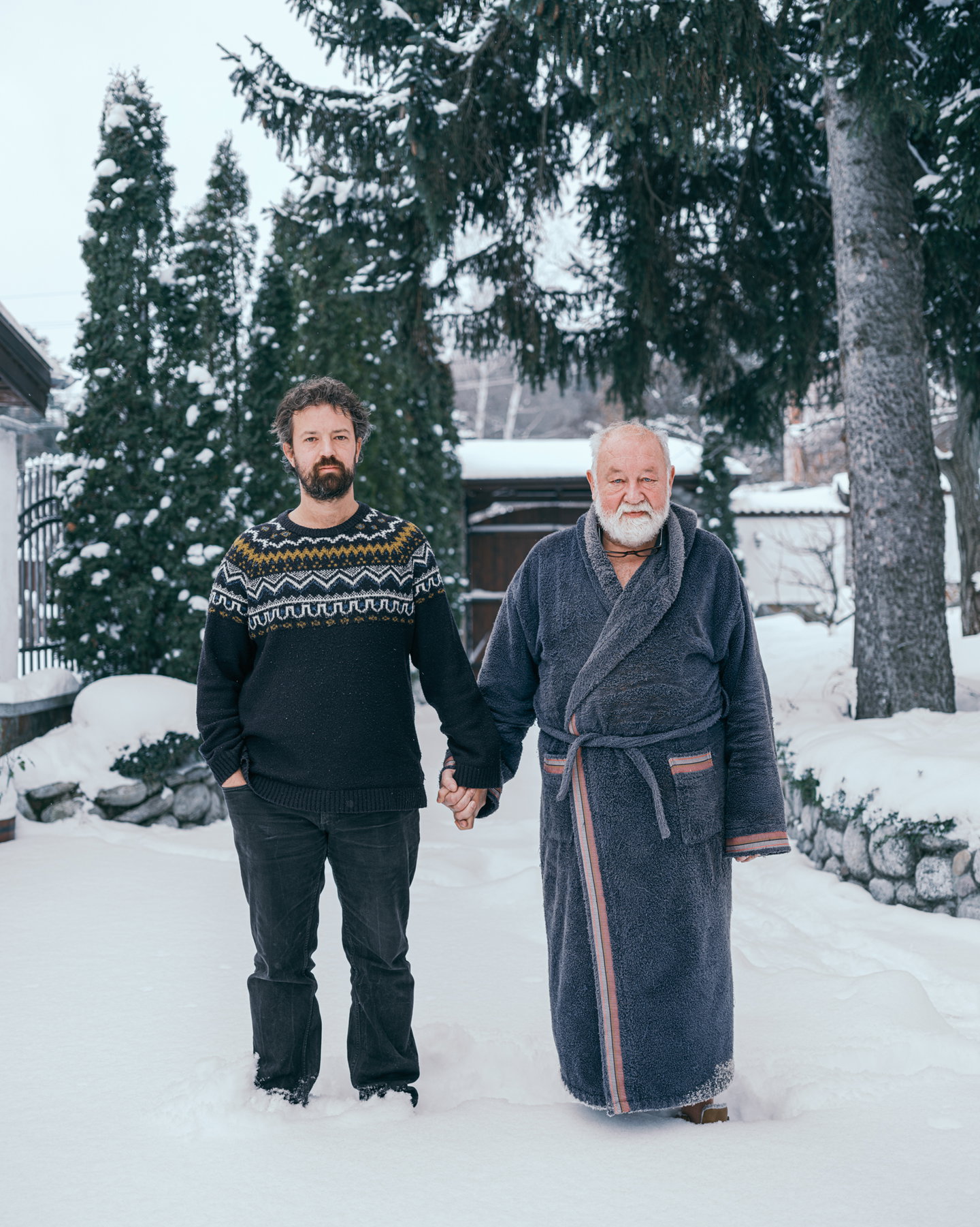 Valery Poshtarov’s portraits of fathers and sons holding hands is a study of “what remains unsaid between men”