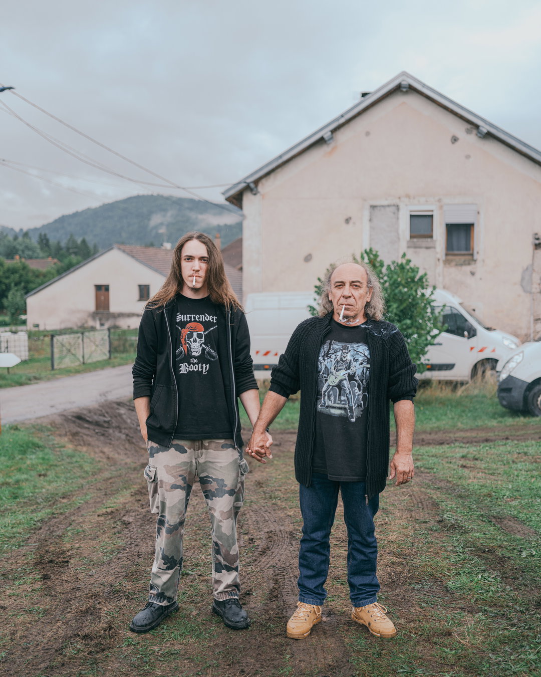 Valery Poshtarov’s portraits of fathers and sons holding hands is a study of “what remains unsaid between men”