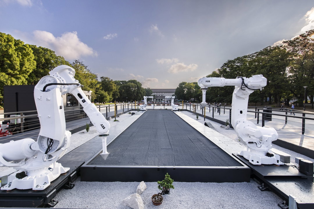 Robotic arms depict athletic motions in a Zen garden, in Jason Bruges’ Tokyo installation