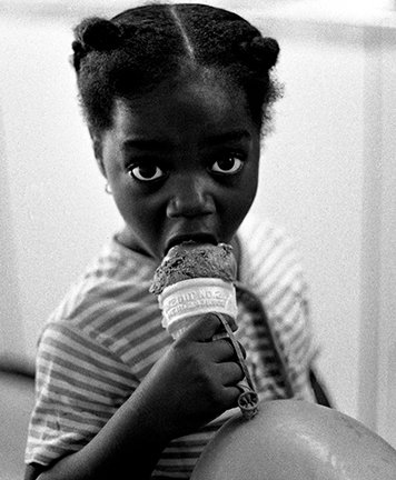 John Simmons_ Girl Eating Ice Cream, Chicago, IL, 1967 © John Simmons.jpg