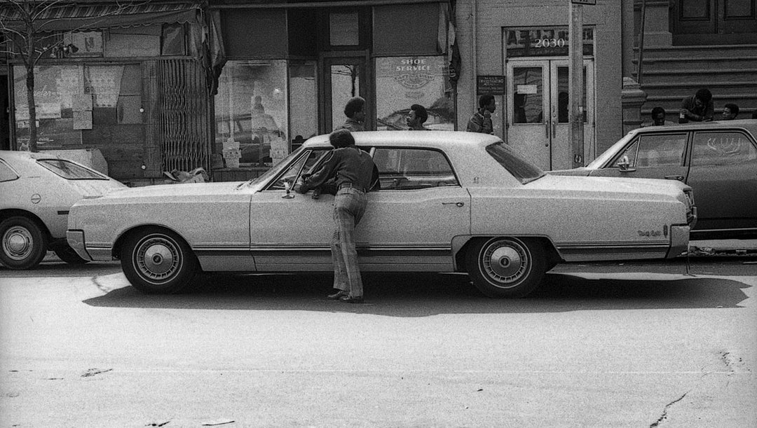 John Simmons_ Man On Car, NY, circa 1970 © John Simmons.jpg